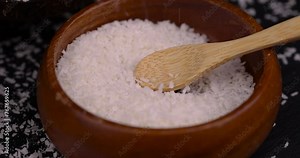 white coconut pulp and dried coconut flakes, a close-up of which is used in the preparation of desserts