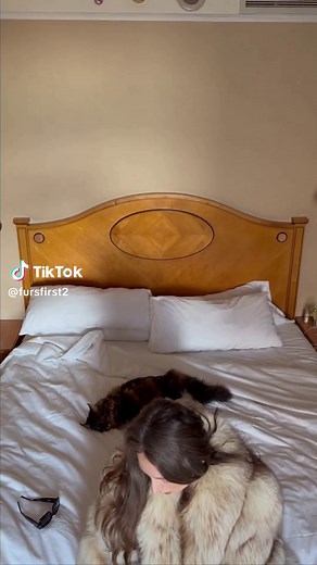 Cozy Moments: Relaxing in a Fur Coat on Bed