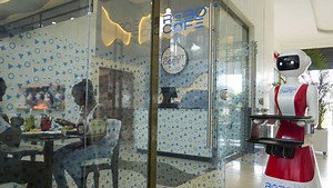 Robot waiters in Kenya create a buzz, but there are concerns about what it means for human labor