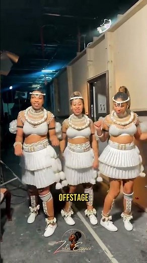 Three Dancers, Matched Down To The Pompoms On Their Ankles