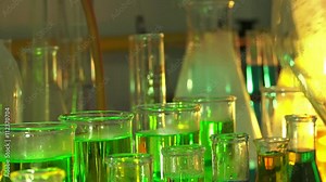 Scientific measurements with multicolored liquids and substances in chemistry lab, ULTRA HD 4K, real time