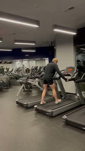 Person can't keep up with the treadmill and falls off of it!