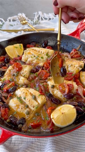 Baked Cod with Roasted Red Peppers, Tomatoes, Kalamata Olives and Capers in White Wine SauceIngredients: 1 lbs Cod Filets 8 oz grape tomatoes 1/2 cup Kalamata olives 1/2 red onion 2 roasted red peppers peppers 1/4 cup olive oil 2 tbs to season fish 1/2 tsp oregano 3 garlic cloves, crushed 1 tsp salt Black pepper, to taste 1/3 cup white wine 3 tbs capers, drained 1 lemon Parsley, for garnish Thyme sprigs, for garnish Method: 1. Preheat oven at 450 F; 2. To a skillet add sliced red onion, tomatoes