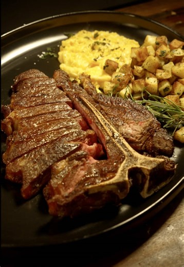 After a lot of people said my English breakfast last week was too American, I figured I would show a proper all-American breakfast. I started with a beautiful T-bone steak, seared hard in a cast iron pan, then basted with herbs and butter until it was deeply browned on the outside. While the steak rested, I fried up some turkey sausage patties and beef bacon, then used all that rendered fat to cook the home fries, which had been boiled and cooled earlier. They soaked up all that bacon fat and we