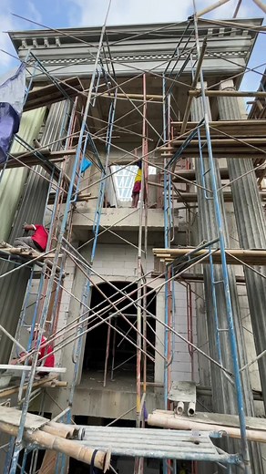 Construction Workers in Action on a Building Site