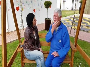 David Geyer, deafblind, communicating with the Tadoma method.