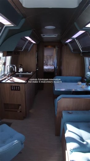 Innovative Spaces on Instagram: "If you’ve ever wondered what midcentury modern design paired with Googie architecture elements might look like in an Airstream...wonder no more. Our renovation transformed inside and out, from walnut and aluminum finishes that echo retro-futurism to modern tech like backup camera monitors, Samsung projector, and Starlink connectivity. Drop ‘Beastie’ in the comments to tour the full build and we’ll DM you the link. ——— Midcentury Modern Interior Design | Airstream