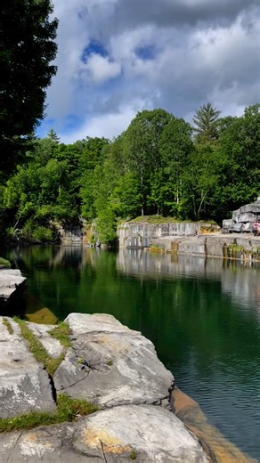 Travel Like a Local: Vermont on Instagram: "The Dorset Marble Quarry is one of Vermont’s most unique swimming holes, and the oldest commercial marble quarry in the U.S., dating back to the 1780s. ☀️ 🍃 These towering marble walls once supplied stone to buildings across the country, including the New York Public Library. Now? They’re a backdrop for unforgettable summer swims in a beautiful setting. 🧊 The water is cold (usually only 50 degrees in the summer!), clear, and up to 60 feet deep in pla