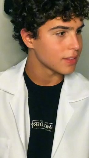 Curly-Haired Scientist in Professional Lab Coat