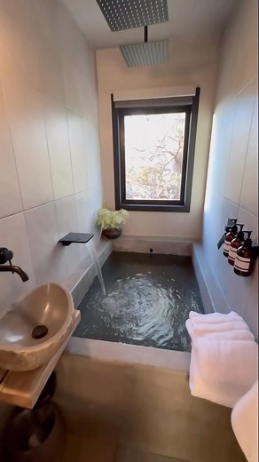 Running Wolves Lodge on Instagram: "This bath-room has been a renovation dream of mine since I started Airbnb/vacation rentals in 2017 with two yurts out in Joshua Tree, CA. We poured concrete for the look and tiled the walls to allow the shower to splash. I wanted all-gray to mimic being in an outoor waterfall. I LOVE baths & I thought it would be so relaxing and magical to take away all distraction and build a room completely dedicated to The Bath….I was right. I could stay in here for hours🤩