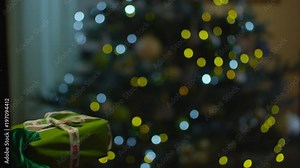 Santa Claus getting out from chimney and putting wrapped present box under the chritmas tree. Beautiful New Year interior. Shot on RED Cinema Camera. Stock Video