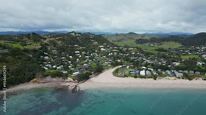 Hahei, New Zealand: Aerial drone footage of the Hahei beach and resort town in the Coromandel peninsula in New Zealand north island.