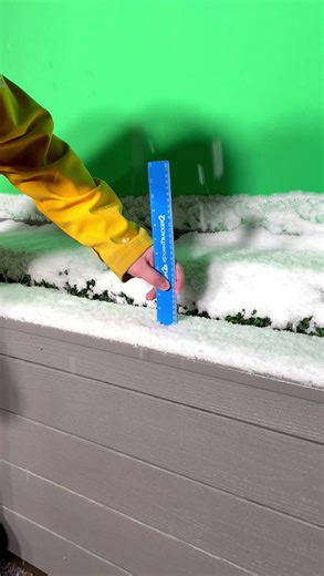 Meteorologist Thomas Patrick takes a live snow measurement during some heavy snow Tuesday morning. | KREM 2 News