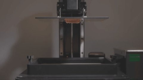 clip-3960882941-resin-dental-crown-printing-on-platform-additive