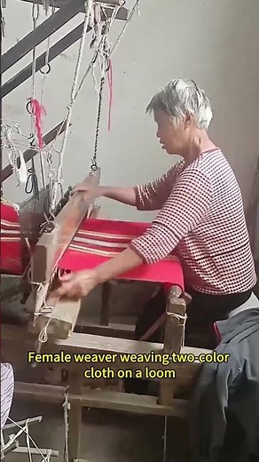 Female weaver weaving two-color cloth on a loom