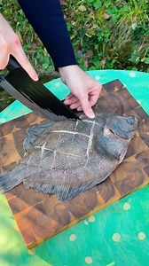Camembert-Style Fish Roasted on Coals 🐟🔥🍊 I cooked my fish directly on the coals. First, I scored the skin with deep stretches, then seasoned it with paprika, garlic, oregano, and a little oil. The heat from the coals made it smoky on the outside and tender on the inside. After roasting, I placed it on top of warm rice. Then I made a bright sauce from orange juice mixed with garlic and paprika — poured it over the rice and over the fish, added some greens on top, and the dish was ready. Smoky