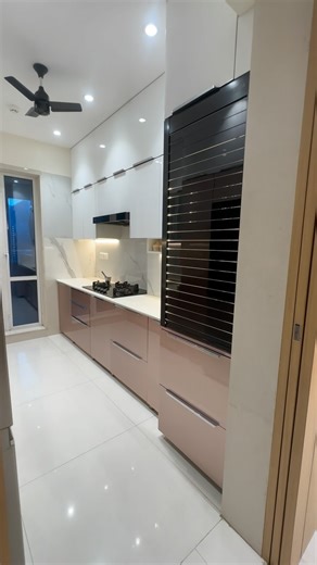 “Discover the elegance of our luxurious modular acrylic finish kitchen design by Surekh Interior. Featuring a well-organized pantry unit for small items, a rolling shutter for mixers and more, and a sleek chimney for a modern touch. Email us at info@surekhinterior.com for inquiries. 🏡✨ #SurekhInterior #KitchenDesign #LuxuryLiving” #modularkitchen #kitchendesign #kitchendecor | Surekh Interior