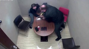 Dramatic struggle ensues for officer's gun inside police interview room