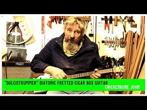 Dulcistrummer diatonically fretted cigar box guitar by Chickenbone John