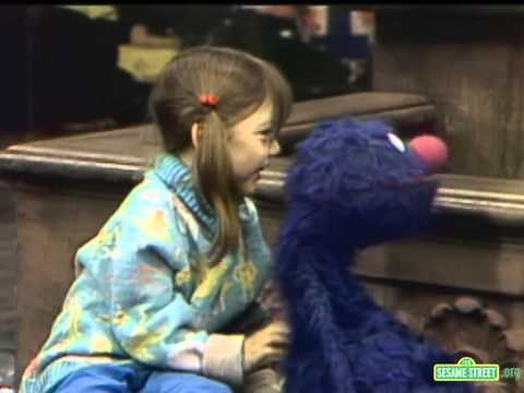 Sesame Street Heather Scatches Grover's Back