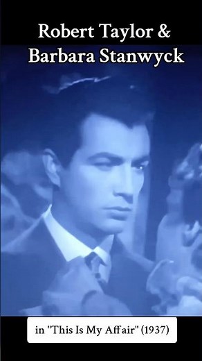 Robert Taylor and Barbara Stanwyck in romantic scene from the 1937 film "This Is My Affair"