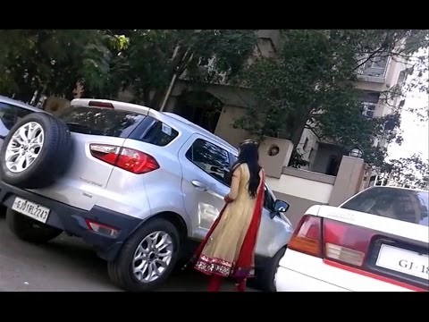 College Girl Driving Ford Titanium Car in Beautifull Red Dress