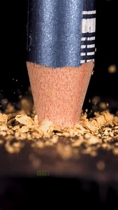 Pencil impact in extreme slow motion close up