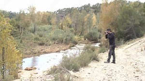 Adventurous boy making landscape photography in a beautiful natural environment