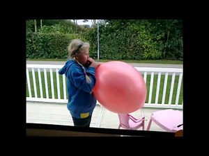 funniest video of a young girl blowing up huge balloon until it explodes