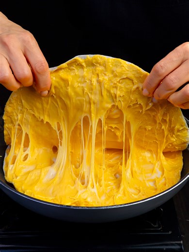 Once you try this recipe, you will become addicted! Ingredients pita bread: 12 pc melted cheddar pressed cheese: 500 g (18 oz) onion: 1 pc green bell pepper: 1 pc minced meat: 700 g (25 oz) garlic: 2 cloves salt: 2 g (0.1 oz) black pepper: 1 g (0.0 oz) sweet paprika: 1 g (0.0 oz) tomato sauce: 180 g (6.3 oz) basil: 3 g (0.1 oz) sliced processed ​​cheese: 40 g (1.4 oz) eggs: 1 pc milk: 50 ml (1.7 fl oz) mozzarella: 200 g (7.1 oz)