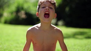 kid salivation girl opens her mouth child shows his teeth soft palate and mouth to dentist. mouth is wide open, tongue is stuck out as far as possible, with clear view of tongue