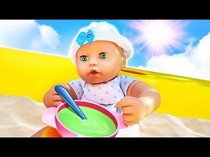 Baby Annabell doll goes for a walk. Baby doll plays with sand. Pretend to play cooking toy porridge.