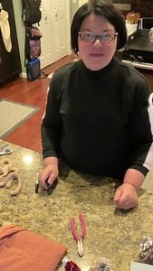 A cute snowman ornament made from chenille chunky yarn and a Dollar Tree tinsel snowman. | The Silver Farmhouse