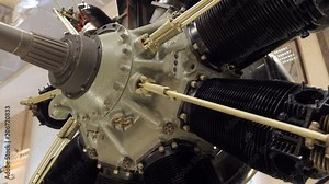 The view of structure of the piston aircraft engine. There are crankshaft, connecting rod, lots of pipes and other elements