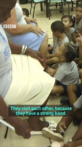 Drug-related violence in one of Rio de Janeiro's favelas is leaving residents lonely, but one daycare centre is helping, by uniting both young and old. #crossingdivides https://bbc.in/2Tymzjb | BBC News