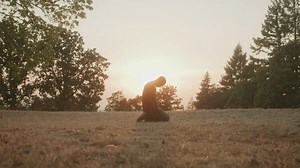 clip-1101577127-spiritual-man-kneeling-praying