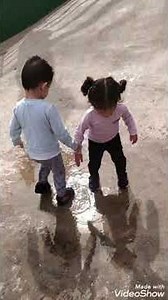 Twins jumping up and down in water Splish, splash, splosh peppa pig song