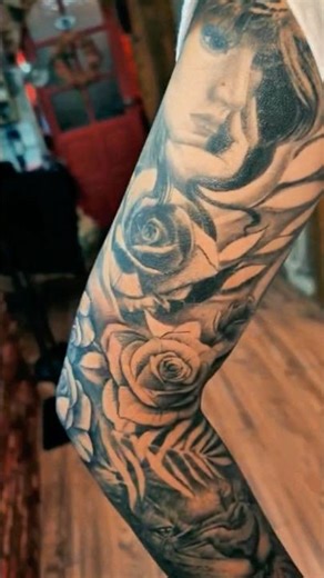 tattoo design concept for a woman’s arm that represents charm, femininity, and strength, while also