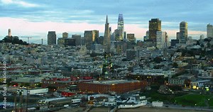 Aerial view of the San Francisco Financial District. Famous skyscrapers, the Coit tower and the Oakland Bay Bridge. Shot in 8K. California, United States.