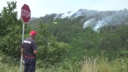 Images of Air Tractor AT-802F aircraft dropping water over a forest...