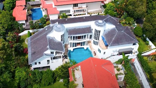 Good Class Bungalows are the most prestigious and expensive homes in Singapore. GCBs even inspired homes in the movie "Crazy Rich Asians." Today, their prices are soaring as the island's ultrarich are fighting to get one. And there are all kinds of building rules owners have to follow once they get a GCB. We tour two Good Class Bungalows with Julian Yip, managing director of Realstar Premier Group, and Billionaire's Row with YouTuber Si Ling to see how these rising prices could affect the rest o