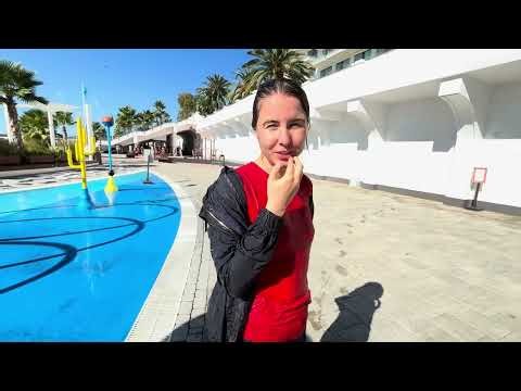 in a windbreaker and jeans by the fountain #jeans