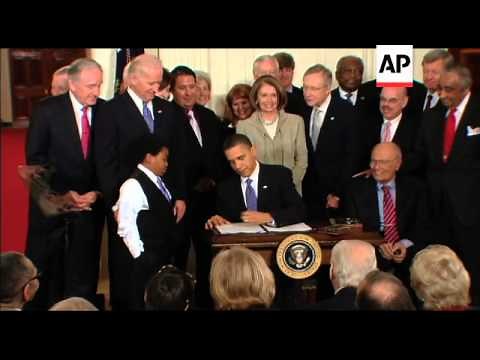 President Barack Obama signs the Patient Protection and Affordable Care Act
