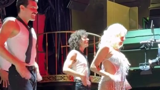 Pixie Lott dances at nearly seven months pregnant as she wears showgirl outfit