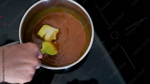 cooking caramel yourself in the kitchen, homemade cakes, the cooking process. A pastry chef cooks caramel for making a cake