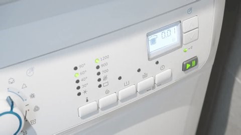 clip-4006576621-electronic-washing-machine-panel-displays-end-program