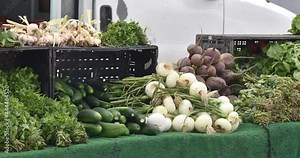 Fresh local organic produce on display at an outdoor farmers market
