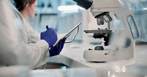Man, scientist and writing with book for results, research or examination in forensics at laboratory. Closeup of male person taking notes for new discovery, breakthrough or findings on test at lab