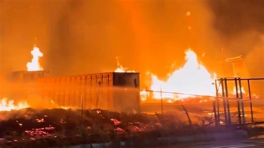 Dramatic moment fire tornado spirals into sky during huge industrial blaze in Spain