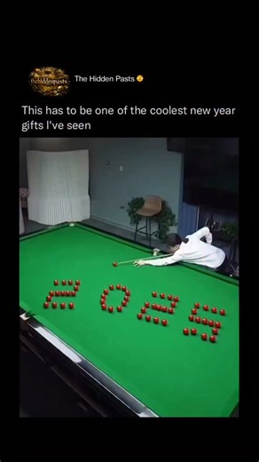 History 📌 Entertainment 📽️ News 🎤 on Instagram: "A complex pool trick shot shows many red balls set up to spell the word “LOVE” on the table. When the player hits the white ball and says “C’est parti!” the balls scatter perfectly and rearrange themselves into the numbers “2025” and then “2026” to celebrate the New Year. Follow @thehiddenpasts for more This amazing move combines art and physics. It uses the way balls bounce and move to change the pattern perfectly. Because it requires such exa